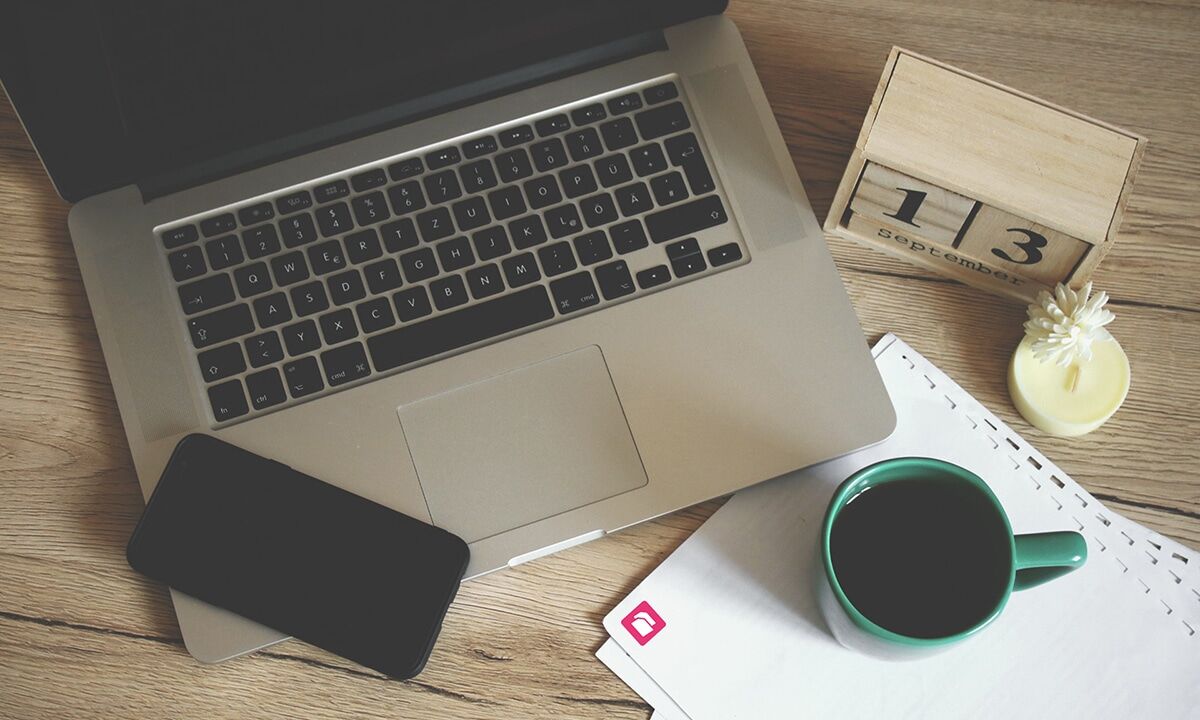 laptop beside a coffee