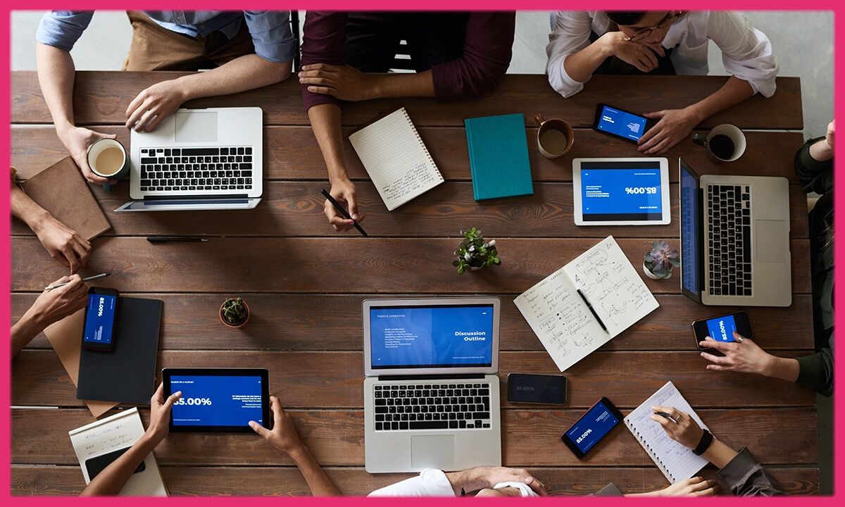 table with people and gadgets