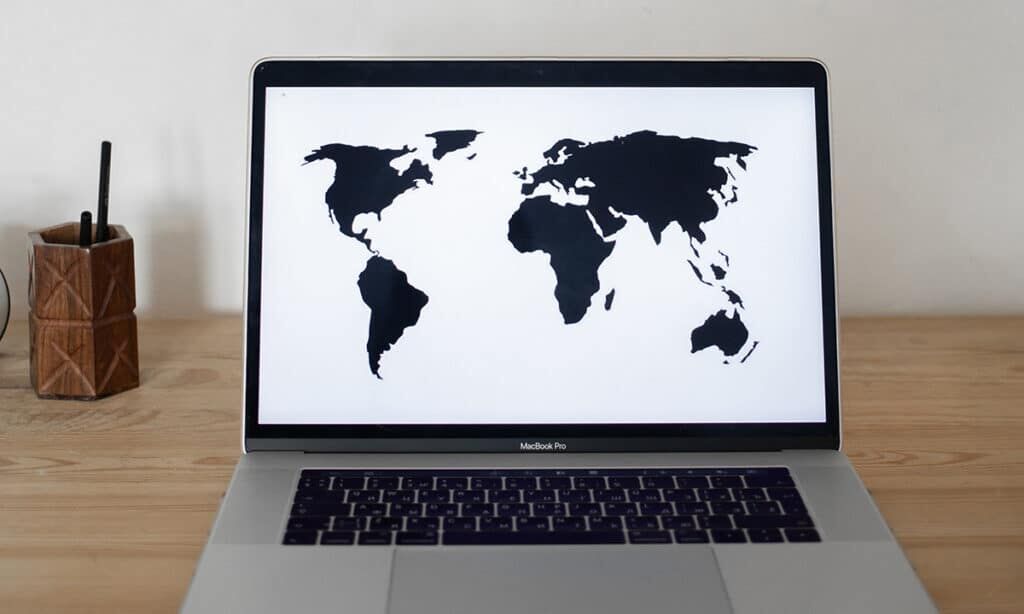 map of the world on screen of a macbook
